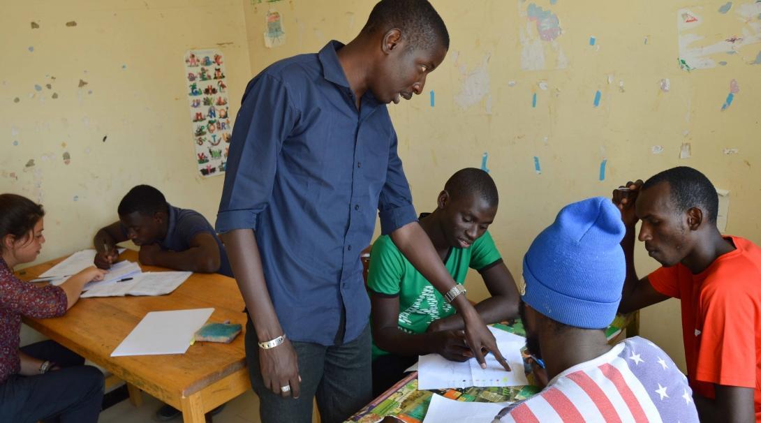 A Projects Abroad intern works with local community members as part of his micro-finance work experience in Senegal. An intern works with members of a local community during his Micro-finance internship in Senegal.